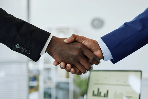 close-two-business-people-shaking-600nw-2172227403